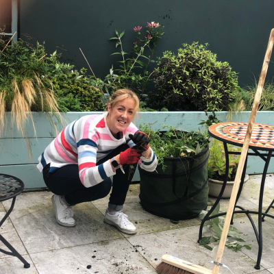 Suzanne Murdock tending plants on the roof garden at The Hub Newry